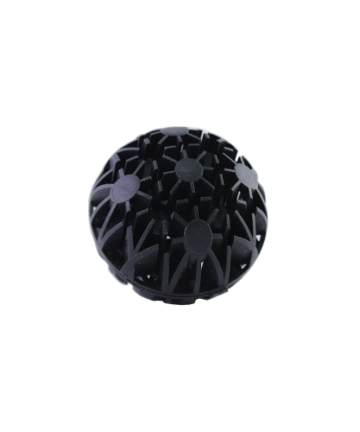 A single Emaux bio-ball which is black in colour with notches to trap dirt.